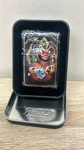 lot 16 image: Evil Clown Biker Lighter in Tin Box,  New