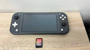 lot 36 image: Nintendo Switch Console with game.
