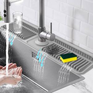 lot 18948 image: Hugro Tarfive 24-Inch Kitchen Sink Splash Guard Mat  7° Slope for Fast Self-Draining  Snap-Lock Design  Universal & Cuttable Silicone Faucet Mat Gray - Retail $22