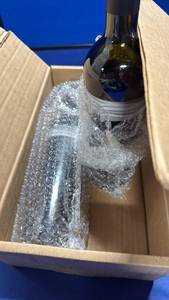 lot 108 image: 2- empty wine bottles  - Retail $8
