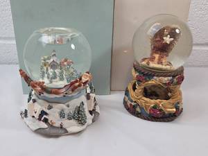 lot 8 image: Musical Snow Globe Collection with Angel and Christmas Village Scenes