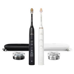 lot 1072 image: Philips Sonicare DiamondClean Connected Electric Toothbrush 2 Pack, x2 Sonic Toothbrushes, x2 Charging Travel Cases, x2 A3 Brush Heads, 12 Brushing Settings, (White with Silver & White with Gold) - Retail $237