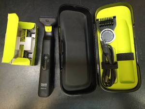 lot 1107 image: Philips Norelco OneBlade Face and Body Grooming Kit - Retail $52