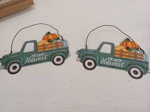 lot 10779 image: Metal Hello Harvest Truck Wall Hanging Sign Set of 2