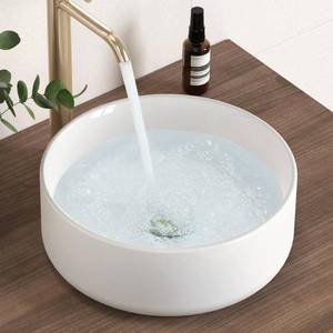 lot 18602 image: 12 in. Round Ceramic Vessel Bathroom Sink Above Counter in White - Retail $82