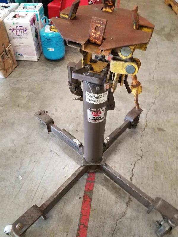 lot 7673 image: NAPA  1000lbs Under Hoist Transmission Jack