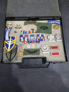Military Insignia and Medal Collection in Display Case