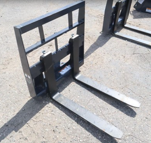 lot 2656 image: Unused Wolverine Mini Skid Steer Pallet Fork Attachment MPF-11-2500G