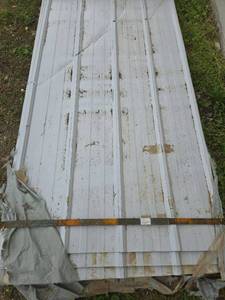 lot 10500 image: Unused Qty. 50 Galvalume Steel Siding  Roofing Panels  White  Cream  Some Metal has damage
