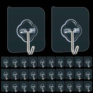 lot 45605 image: Adhesive Hooks, 25 Pack 33lb(Max) Sticky Hooks, Transparent Reusable Removable Adhesive Hooks for Hanging, Wall Hooks for Hanging Can be Use for Kitchen Bathroom Shower Outdoor Home Improvement - Retail $10