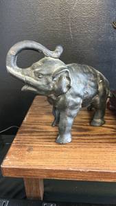 lot 182 image: Cast Iron Elephant Figure and coin bank with Raised Trunk
