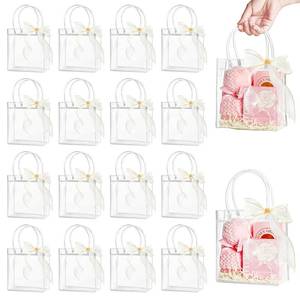 lot 6252 image: Ohuimrt 30 PCS Clear Plastic Gift Bags with Handles, 5.9 x 6.3 x 2.8 Inches Reusable Party Favor Bags with Ribbon Transparent Gift Wrap Bags Bulk for Weddings Birthdays