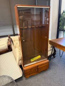 lot 902 image: Cabinet with sliding glass doors 64 x 28 x 11 in with Glengield scope