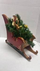 lot 1022 image: Wooden Christmas Sleigh Holiday decor with wooden animas and more inside 13.5x7x16