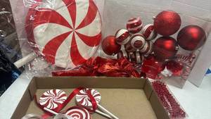 lot 1055 image: Red and White Christmas Decoration Set with Ornaments and Peppermint Candy Props and pinata
