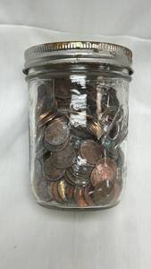 lot 22 image: 16 OZ Mason Jar Filled with Pennies