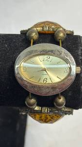 lot 39 image: Decorative Leopard Print Quartz Watch with Ornate Gold-Tone Design