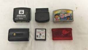 lot 116 image: Handheld Gaming Console Accessories and Game Cartridges Bundle