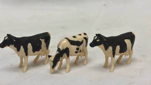lot 129 image: Miniature Holstein Dairy Cow Figurines Set