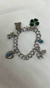 lot 142 image: Silver Tone Charm Bracelet with Travel Charms