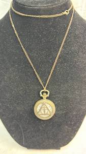 lot 231 image: Gold Tone Deathly Hallows Pocket Watch with Chain