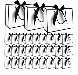 lot 2609 image: swihorab 30 Pcs Gift Bag, Small Portable Paper Gift Bag with Handles, Thank You Party Favor Bags for Wedding Birthday Party Supplies Present Bags for Shopping 11x7.9x4, Black - Retail $0