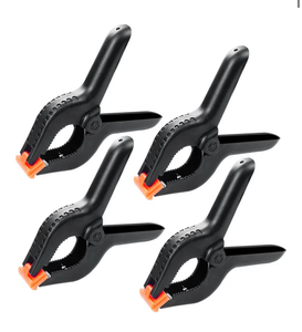 lot 2720 image: 4 Pcs Spring Clamps, 4 in Plastic Heavy Duty Spring Clips for Crafts, Mini Clamps for Woodworking and Backdrop Clips Clamps for Photography for Backdrop Stand Photography Home - Retail $0
