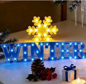 lot 2848 image: 7Pcs Winter Snowflake LED Marquee Light Up Letters Sign Winter Christmas Letter Lights Snowflake Table Decorations Battery Powered LED Lights for Home Indoor Fireplace Wall Holiday Party Decoration - Retail $0