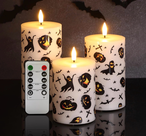 lot 3017 image: Halloween Flameless Pillar Candles with Remote, Flickering Spooky LED Wax Candles Battery Operated Set of 3 - Retail $0