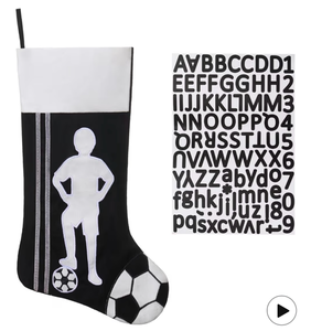 lot 3039 image: 20 Inch Soccer Christmas Stocking-Sports Theme Fireplace Decor with Player Silhouette, Family Holiday Party Supplies, Gift for Soccer Fans - Retail $0