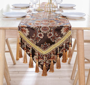 lot 3086 image: Luxury Vintage Table Runner Embroidery Jacquard Fabric with Multi-Tassels Table Runners for Dining Room Dresser Wedding Holiday Party Fireplace Decorations-Brown, 13x70 inch - Retail $0