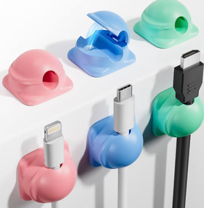 lot 3162 image: 6 Pack Cord Holder Organizer, 1-Handed-Operation Magnetic Cable Clips, Phone Cord Clips Holder with 2 Extra Reusable Strong Adhesive for Nightstand Desk Car Workspace Office Accessories, Colored - Retail $0