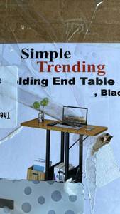 lot 19711 image: Folding End Table with Storage Shelf and Wheels