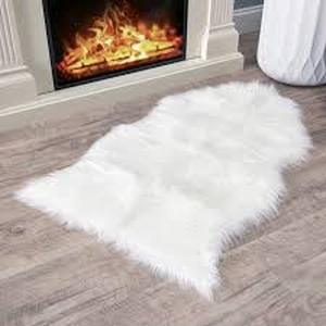lot 13784 image: White 38  24in Sheepskin Rug with User Guide