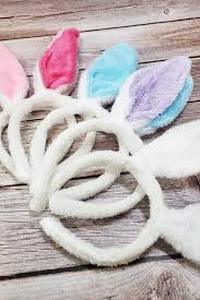 lot 9465 image: Plush Unicorn Hat with Colorful Mane in Wicker Basket