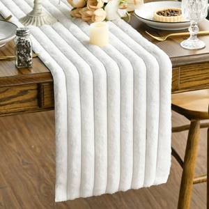 lot 7051 image: Artoid Mode Ivory Soft Plush Faux Fur Jacquard Table Runner, Holiday Seasonal Kitchen Dining Table Decoration for Home Party Decor 13x72 Inch - Retail $12