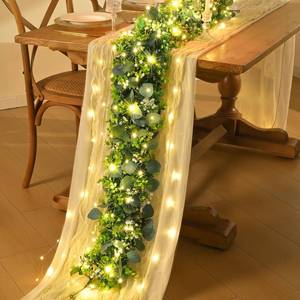 lot 7130 image: 2Pcs Eucalyptus Garland with Lights, Greenery Garland, Green Garland with Flowers, 5.9FT Artificial Faux Eucalyptus Leaves Vines for Table Mantle Home Wedding Party Indoor Outdoor Decor - Retail $17