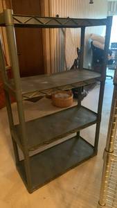 lot 1020 image: Plastic shelving unit located in basement
