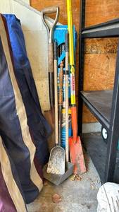 lot 2002 image: Two spades, fireplace tools, and Gutter guard