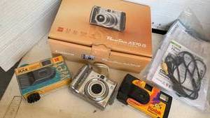 lot 2142 image: Canon PowerShot A570 IS Digital Camera and disposable cameras