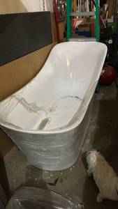 lot 2415 image: Beautiful Modern Freestanding White Soaking Bathtub. 68 in long, 28 inches wide and 35 inches tall at its tallest point