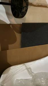 lot 2416 image: Three large sheets of white bead board and a large square of foam