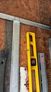 lot 3001 image: Levels, large t square, drywall smoother and metal ruler