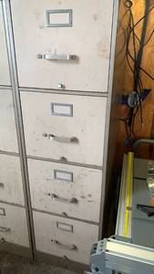 lot 3104 image: 1 Metal file cabinet 52x15x28 needs cleaning