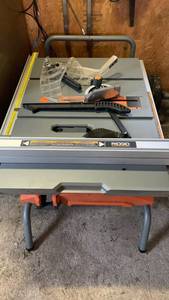 lot 3107 image: Ridgid mobile Table Saw with Stand and Accessories