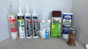 lot 3314 image: Latex caulk, insecticide, sanding belts and pistol pump oiler