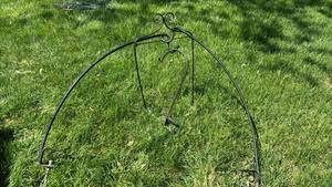 lot 4011 image: Wrought iron plant holder and three Clamps with plant hooks
