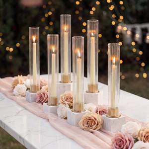 lot 19109 image: NUPTIO Candlestick Holder with Fluted Hurricane Set of 6 Metal Candle Holders with Glass Cylinders - Gold Taper Candleholders for Birthday Valentine Wedding Table Centerpiece Outdoor Decor - Retail $38