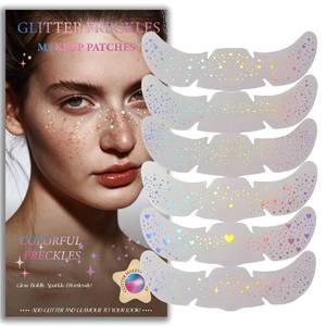 lot 19220 image: Glitter Freckles, Holographic Face and Body Glitter Tattoo Sparkle for Women Gold Glow Cosmetic Star Makeup Accessories for Festival Rave (Holographic) - Retail $6