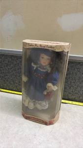 lot 1371 image: Collectors Choice Fine Bisque Porcelain Doll in Blue Dress
